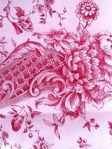 Piece of red toile de jouy fabric